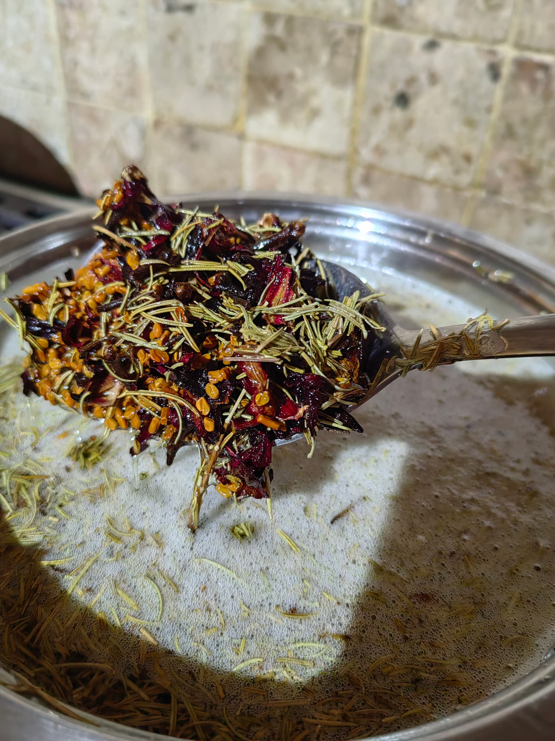 Whole botanicals steeping in oil — the Sanyu infusion process